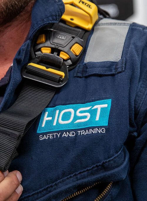 Icam training - close up of host logo on worker shirt